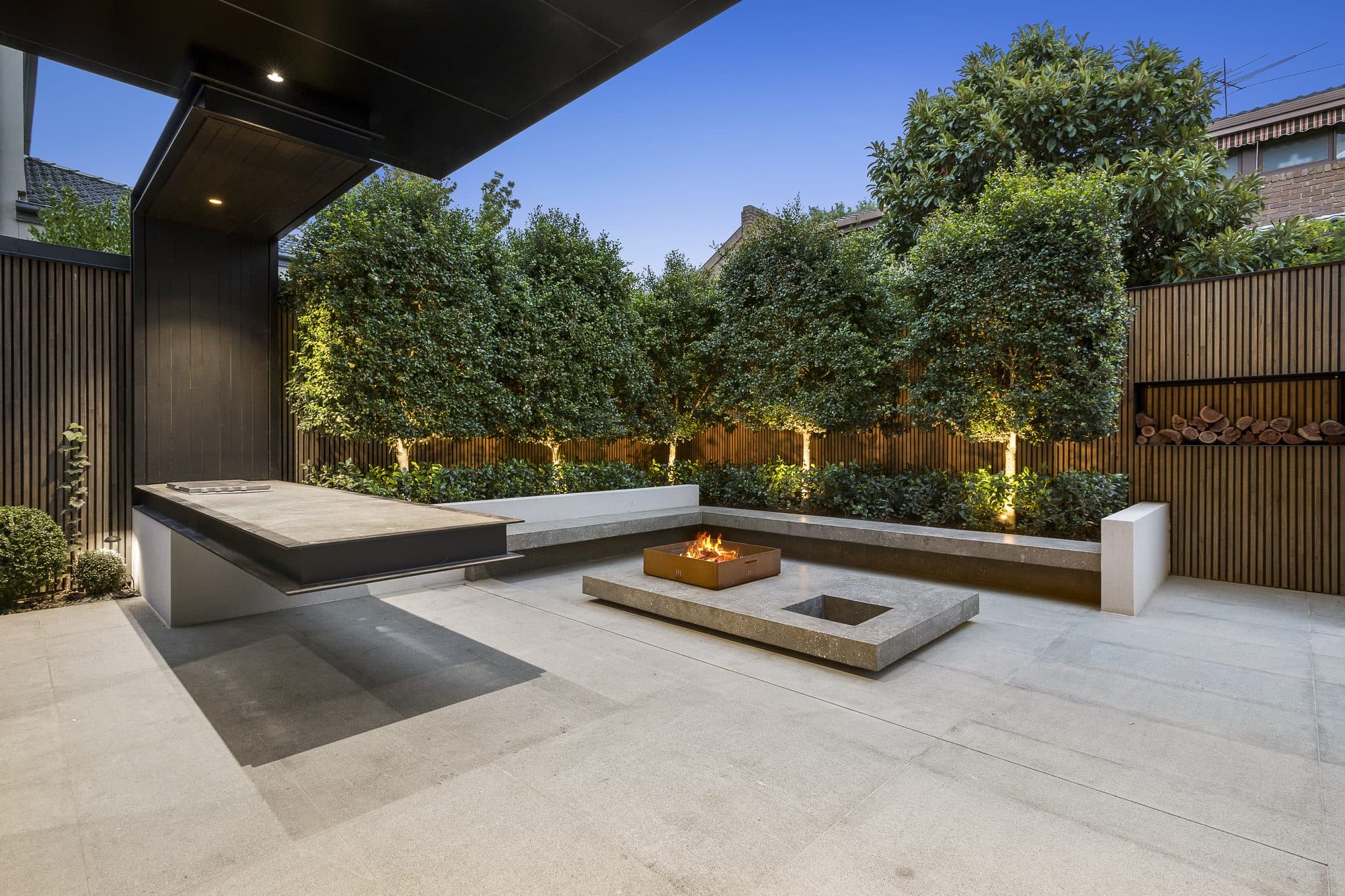 Modern home exterior with precision planting — the result of a fully approved design plan