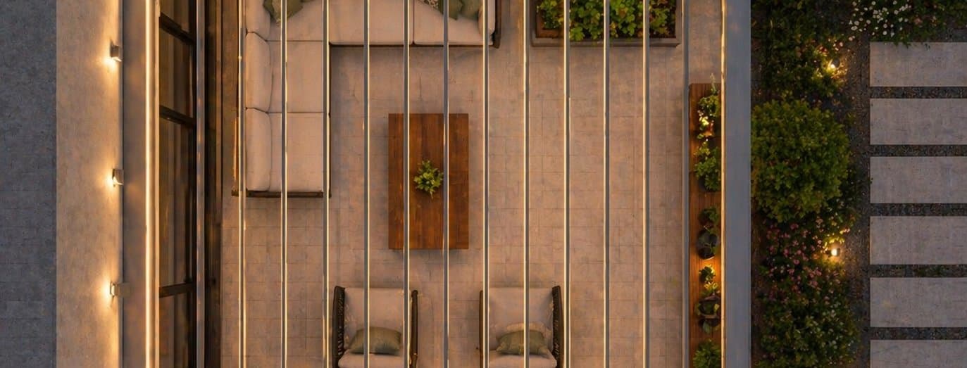 Aerial view of a center-post-free pergola over a courtyard lounge in the evening