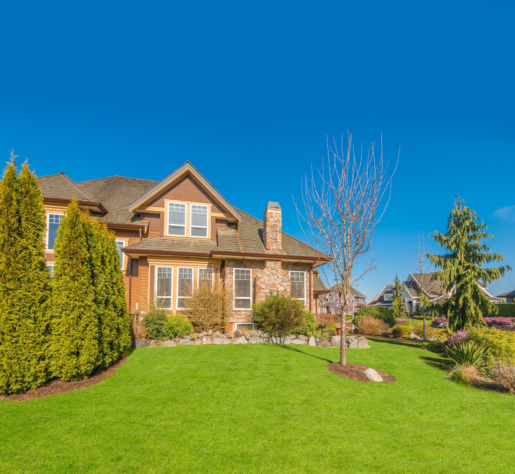Craftsman home with a broad, freshly established sod lawn